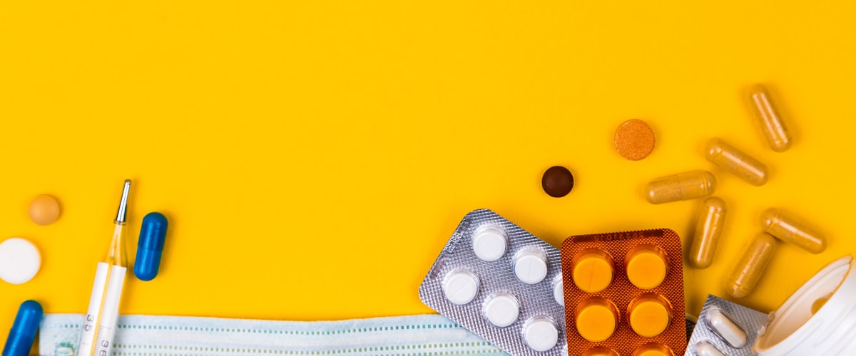 Cold and flu medicines, thermometer and face mask — Pharmacy First NHS pharmacist care in Barons Court